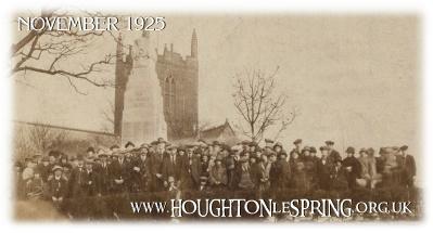 Flowers stacked high in front of Houghton-le-Spring Cenotaph
