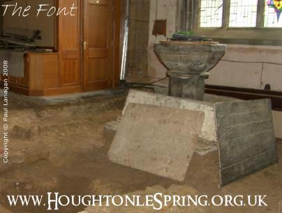 The medieval font in St Michael's Church, Houghton