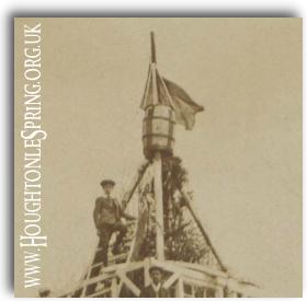 Leslie Holbrook at the top of the bonfire