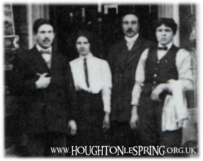 The Rianis outside of their shop in the 1920s