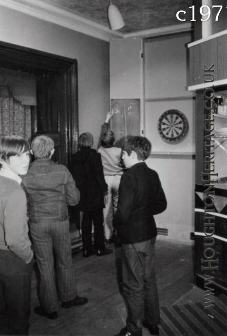 A group of lads playing darts at the YMCA in Houghton Hall, guessed to be around 1971