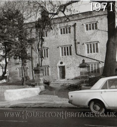 A car passes the front of Houghton Hall in 1971