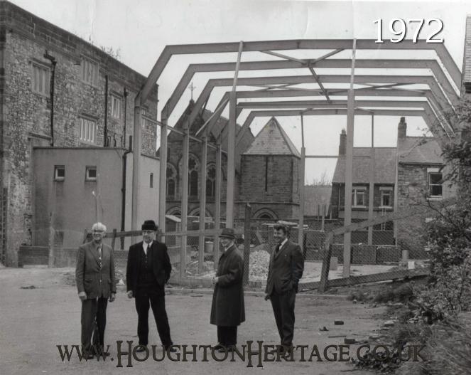 Officers from the YMCA view the construction of the new sports hall at Houghton Hall in 1972