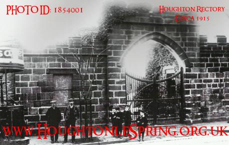 The Rectory archway with a tram passing by