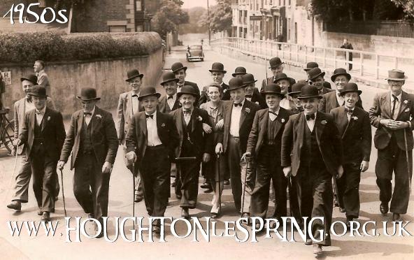 The Jolly Boys return from an outing and head up Church Street towards Houghton Hall Social Club in the 1950s